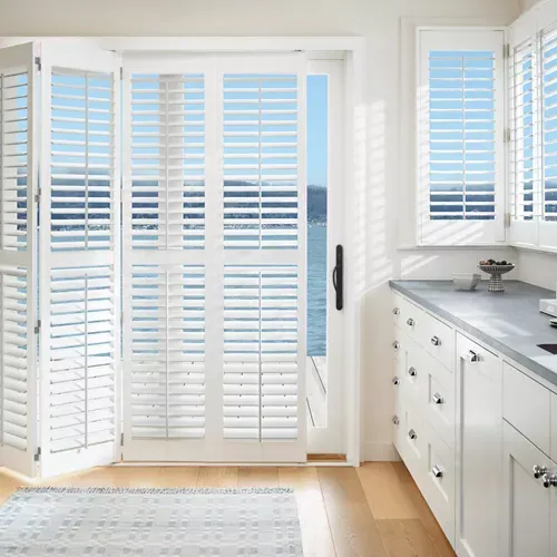 Plantation shutters for sliding glass doors